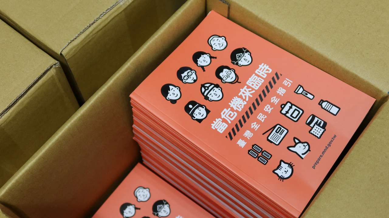 Copies of Taiwan's updated civil defence handbook are seen at a printing house in Taoyuan