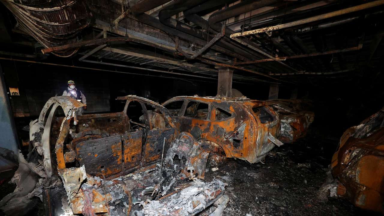 FILE PHOTO: Vehicles that were completely burned down due to a Mercedes Benz electric car fire that broke out on August 1st, are lying in the underground parking lot of an apartment complex in Incheon