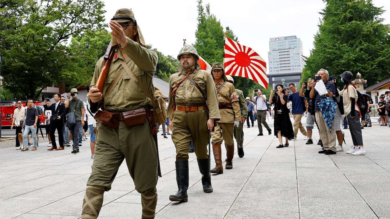 FILE PHOTO: People pay tribute to the war dead on the 78th anniversary of Japan's surrender in World War Two, in Tokyo