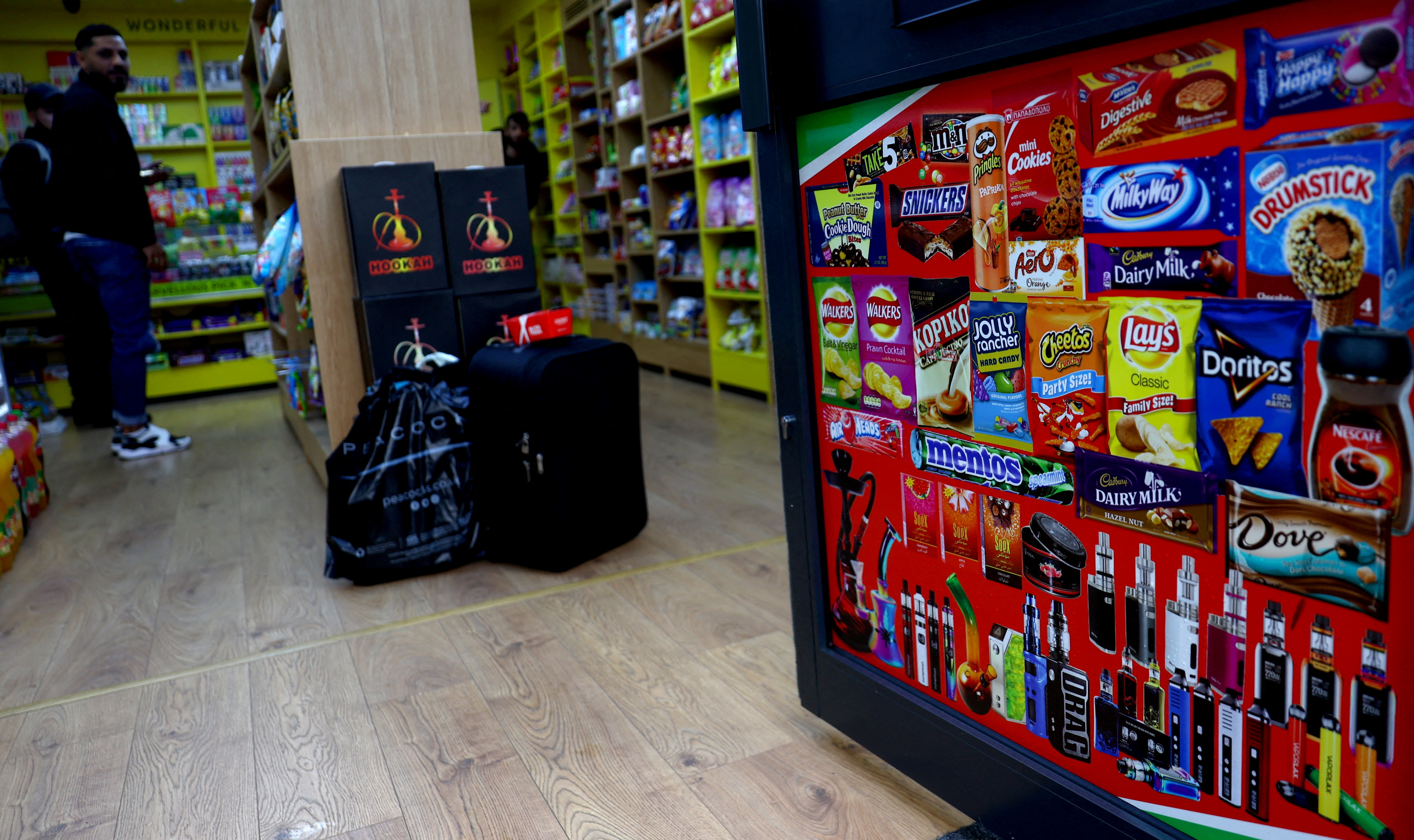 FILE PHOTO: Disposable vapes are advertised on a shop door
