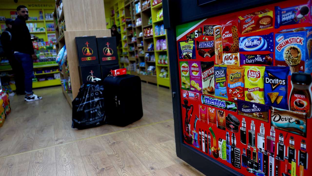 FILE PHOTO: Disposable vapes are advertised on a shop door