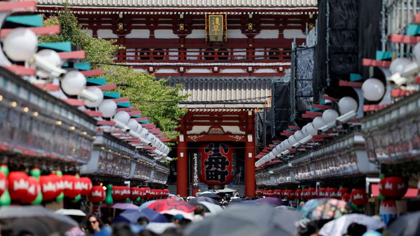 People visit Sensoji temple in Tokyo