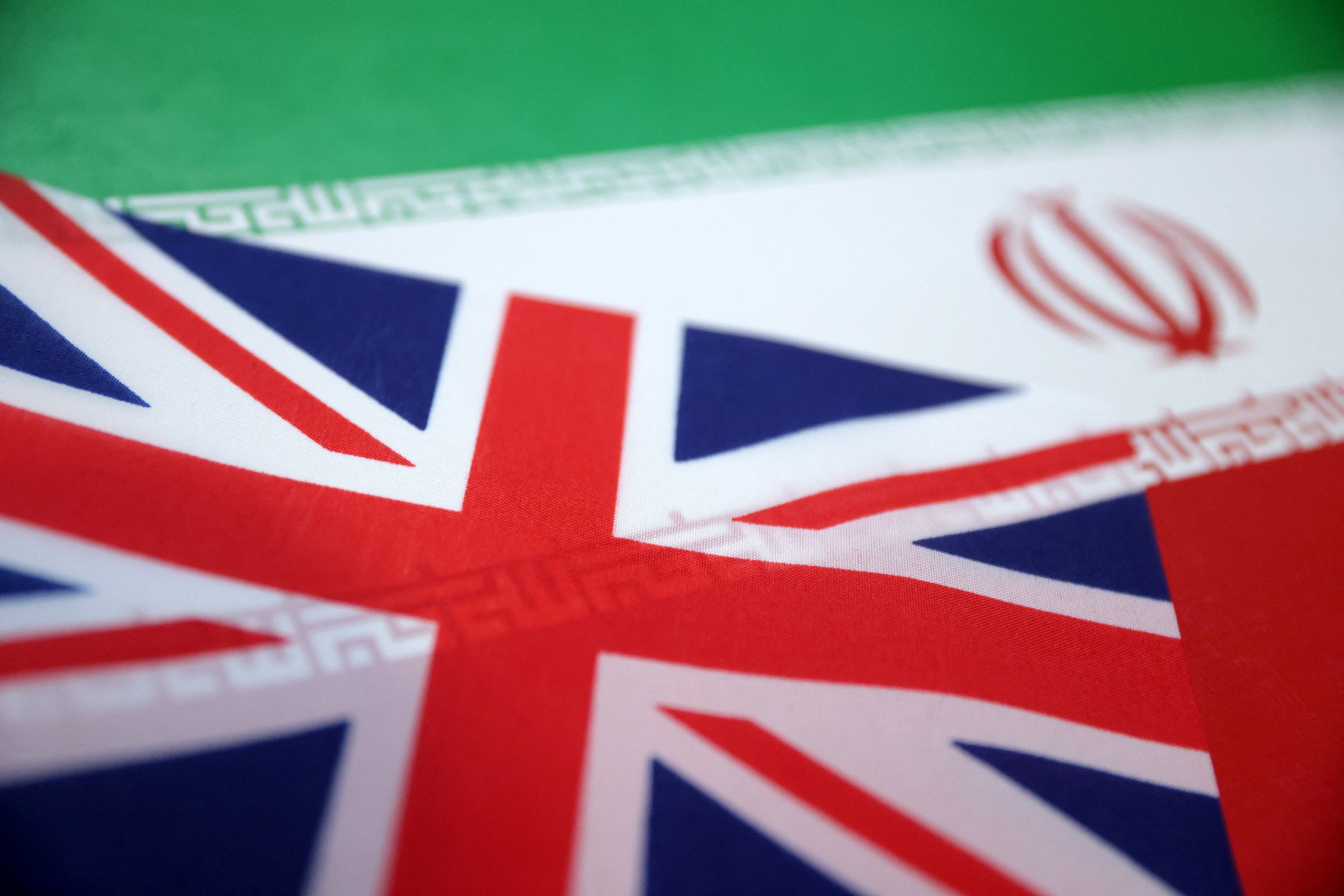 Illustration shows UK and Iran flags