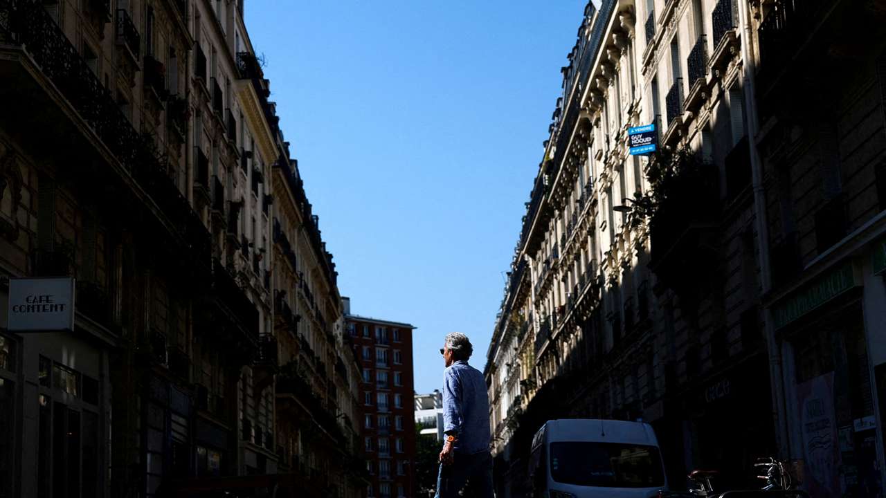 FILE PHOTO: Man walks on Rue Pache street, near the location where a gang attempted to kidnap the daughter of a crypto businessman, in Paris