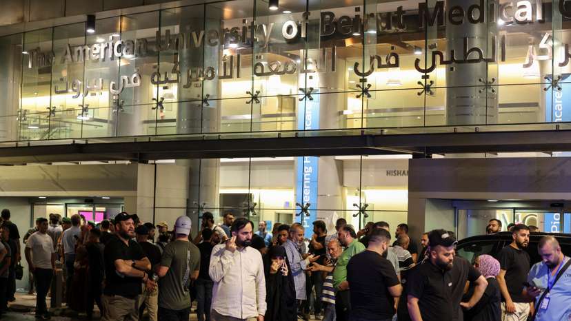 People gather outside American University of Beirut Medical Center (AUBMC) as people, including Hezbollah fighters and medics, were wounded when the pagers they use to communicate exploded across Lebanon, according to a security source, in Beirut
