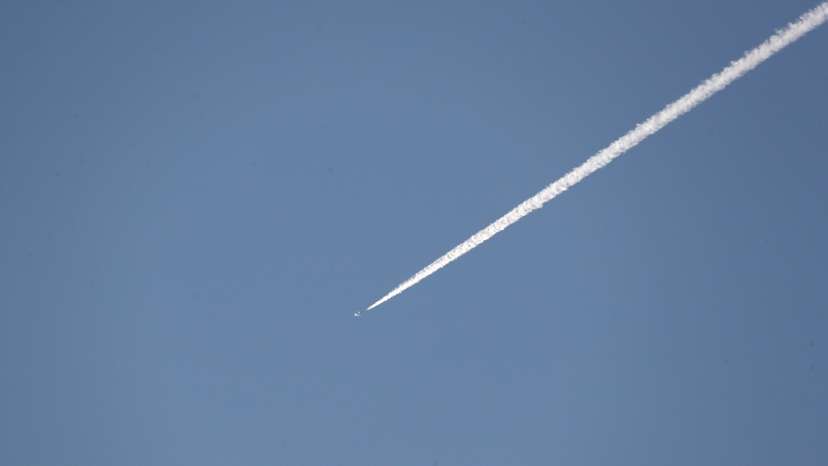 A Turkish fighter jet flies over the town of Hassa on the Turkish-Syrian border in Hatay province