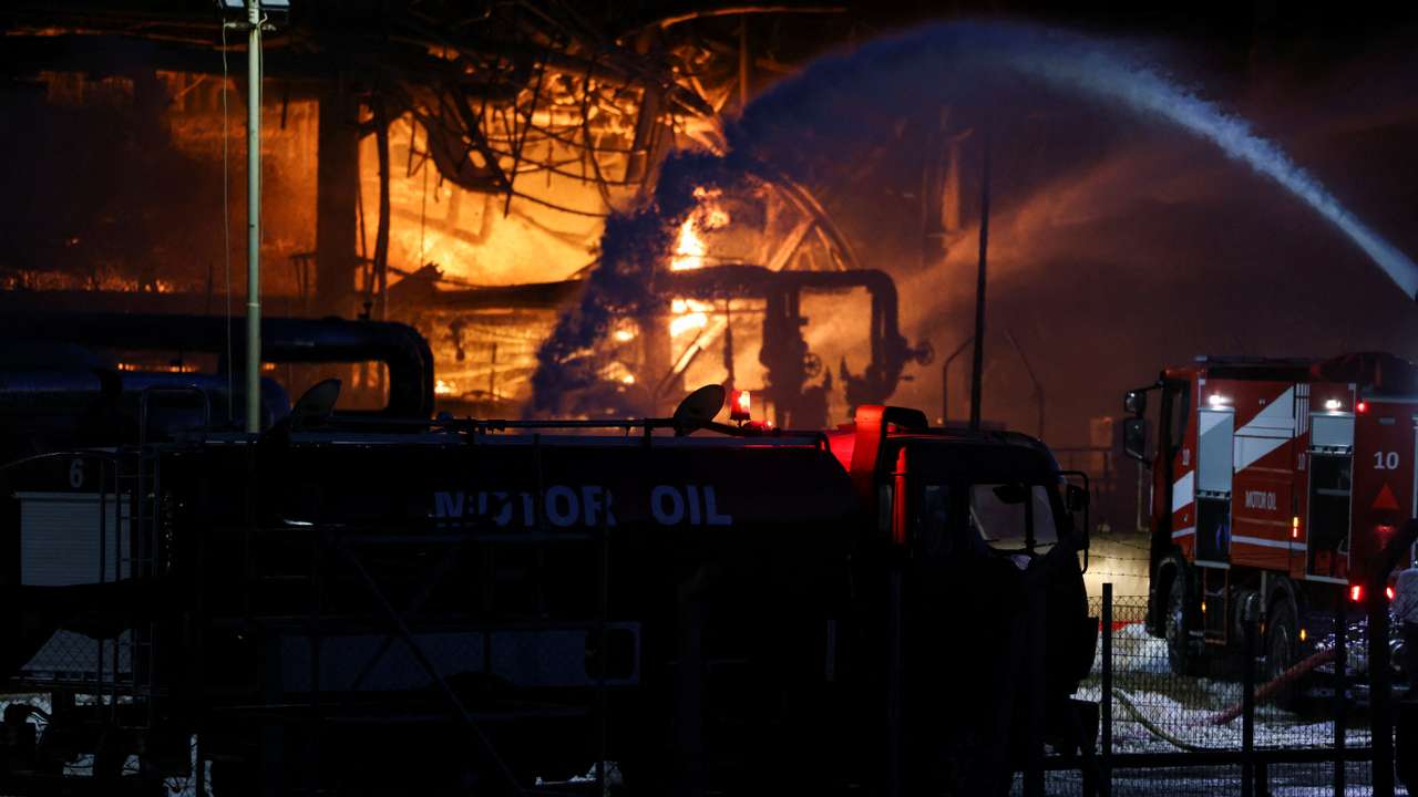 Flames rise as a fire burns at the Motor Oil refinery, in Agioi Theodoroi