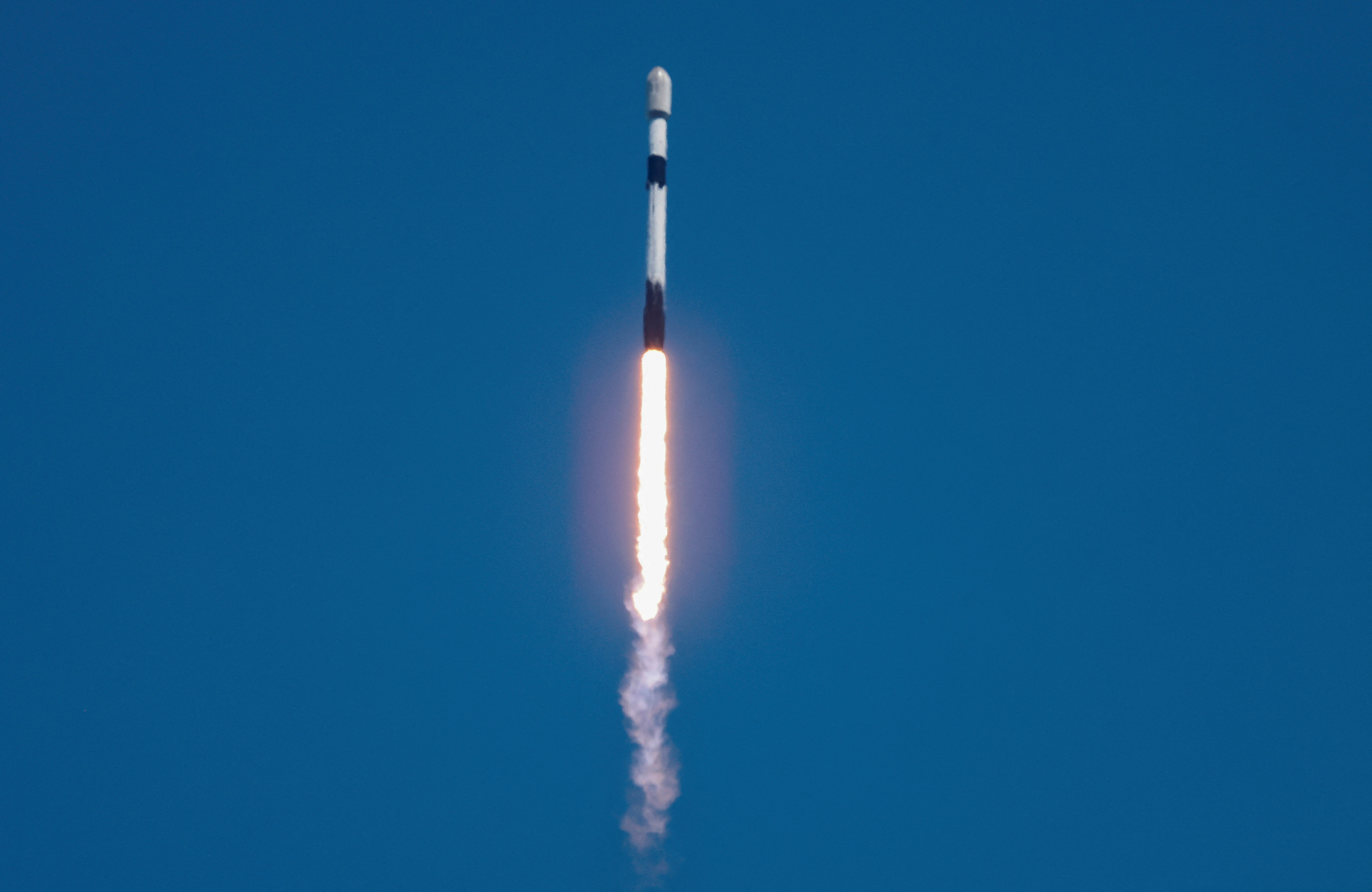 FILE PHOTO: A SpaceX Falcon 9 rocket is launched, carrying 23 Starlink satellites into low Earth orbit from Cape Canaveral