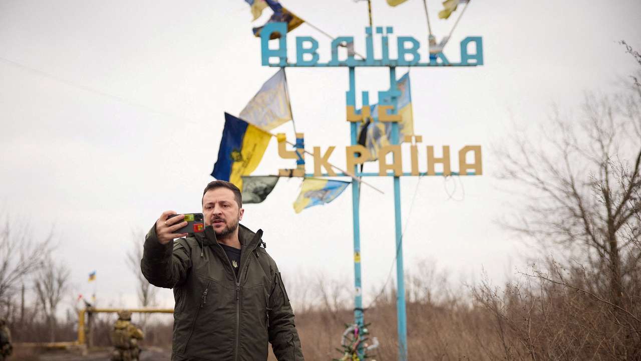 FILE PHOTO: Ukraine's President Zelenskiy takes a video, as he visits in the frontline town of Avdiivka