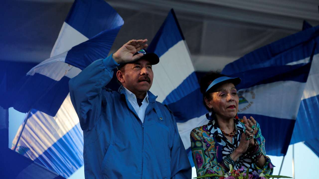 FILE PHOTO: Nicaraguan President Ortega and then-Vice President Murillo gesture during a march in Managua