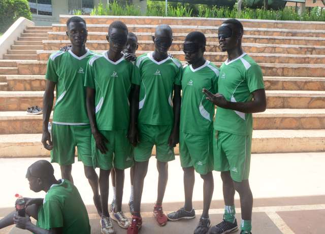blind football players pose for group photo during the competition