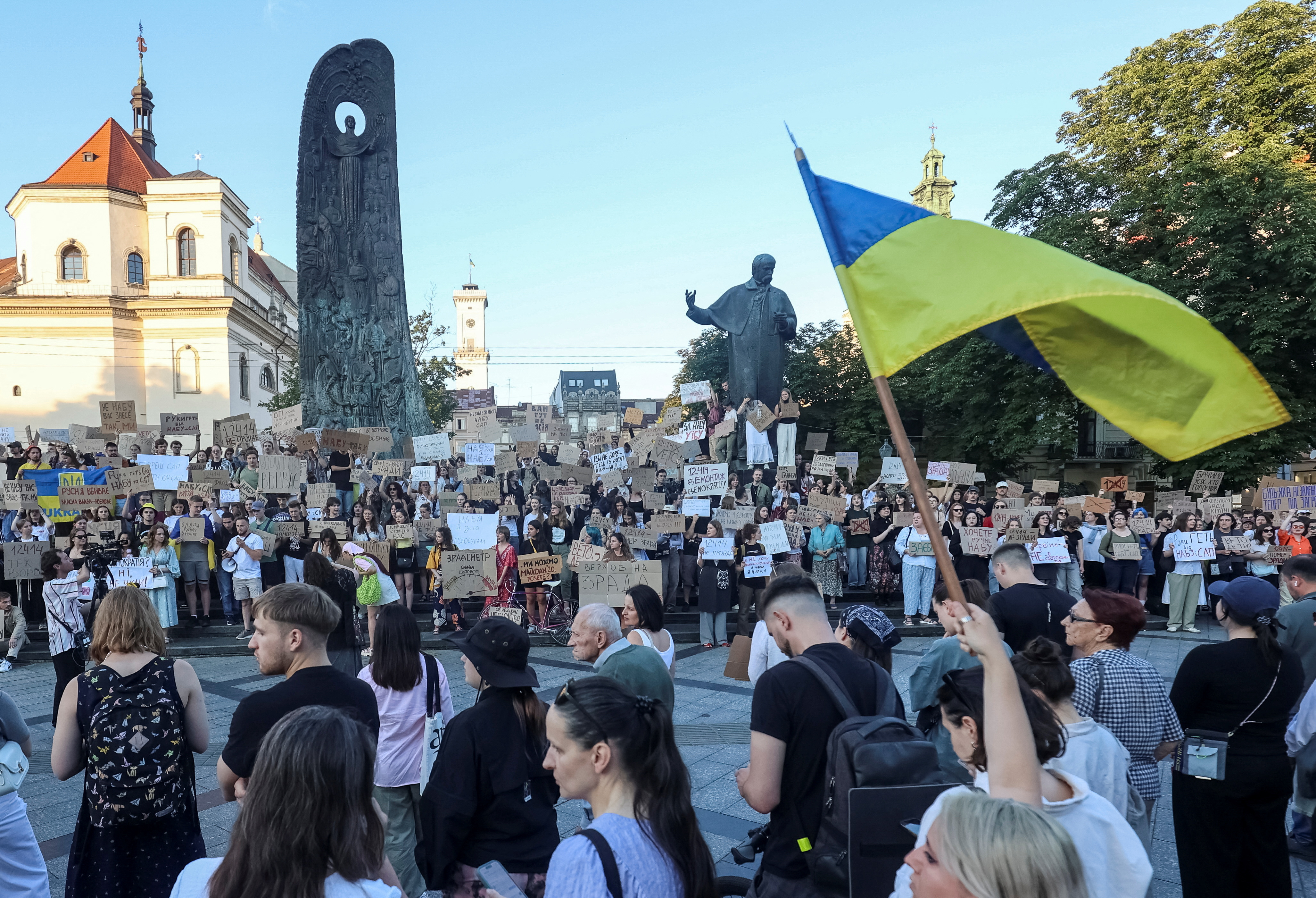 Ukrainians protest against a newly passed law, which curbs independence of anti-corruption institutions in central Lviv