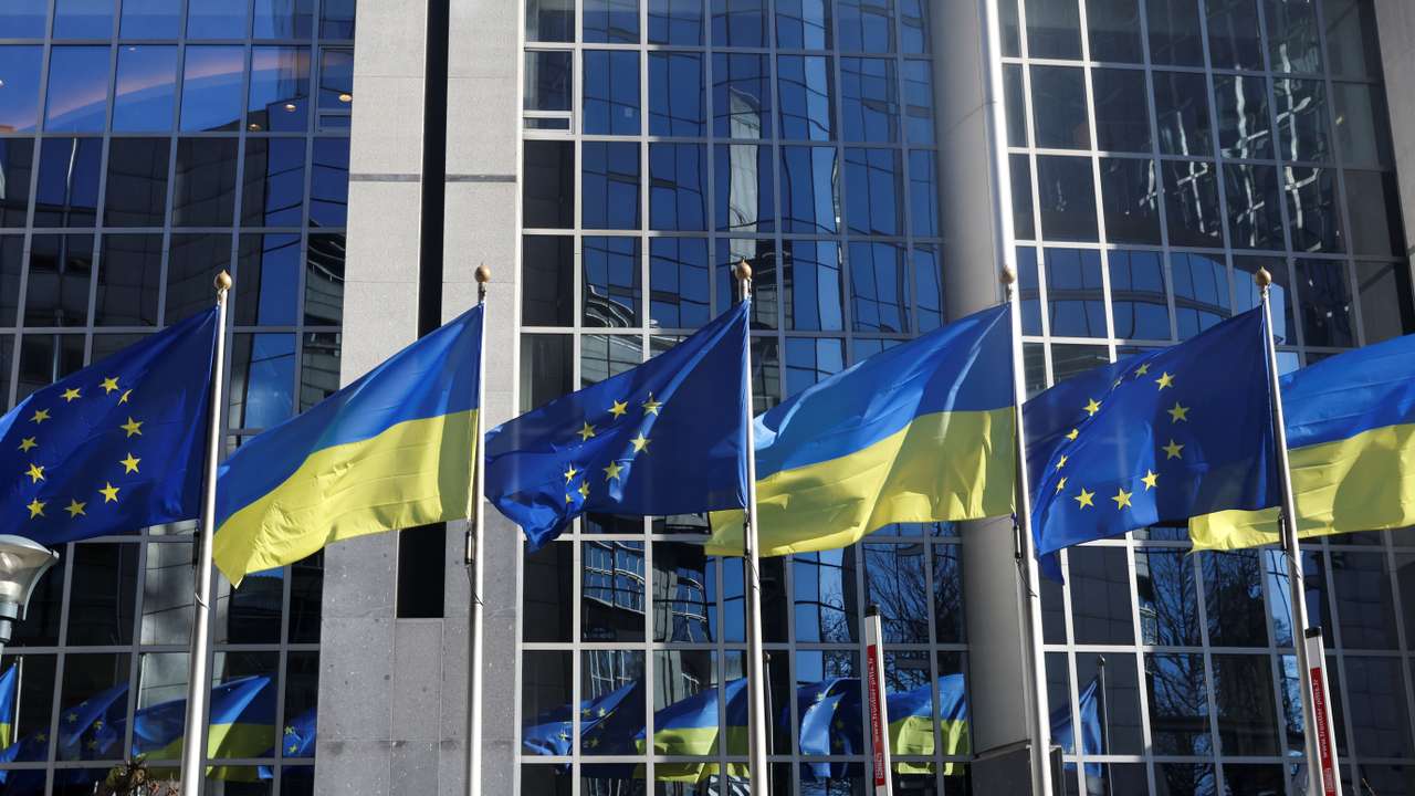 Flags of European Union and Ukraine flutter outside EU Parliament building, in Brussels