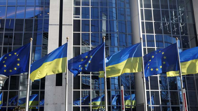 Flags of European Union and Ukraine flutter outside EU Parliament building, in Brussels