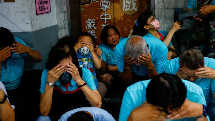 People participate in the annual air-raid exercise in Taipei