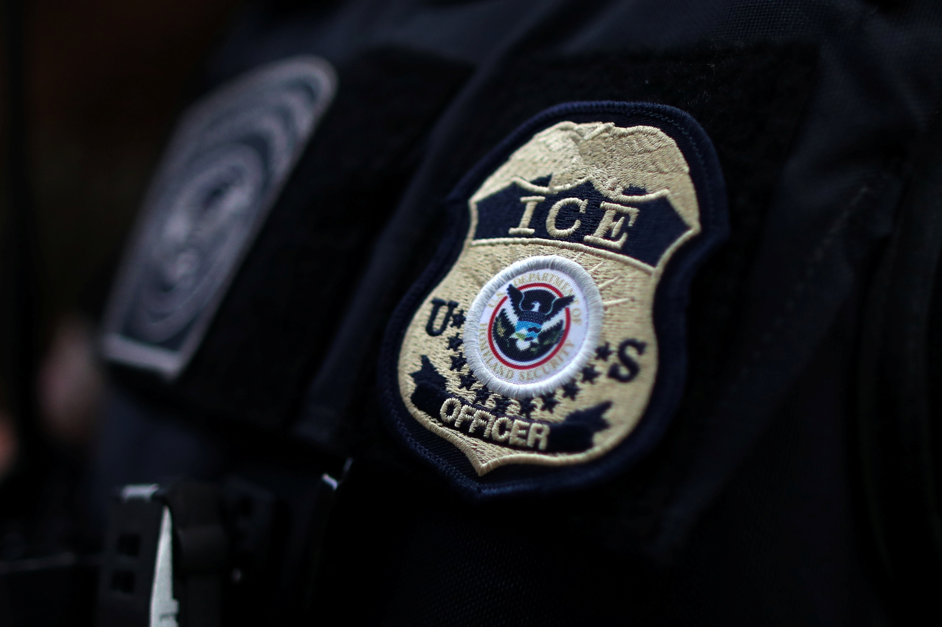 The badge of a U.S. Immigration and Customs Enforcement (ICE) officer
