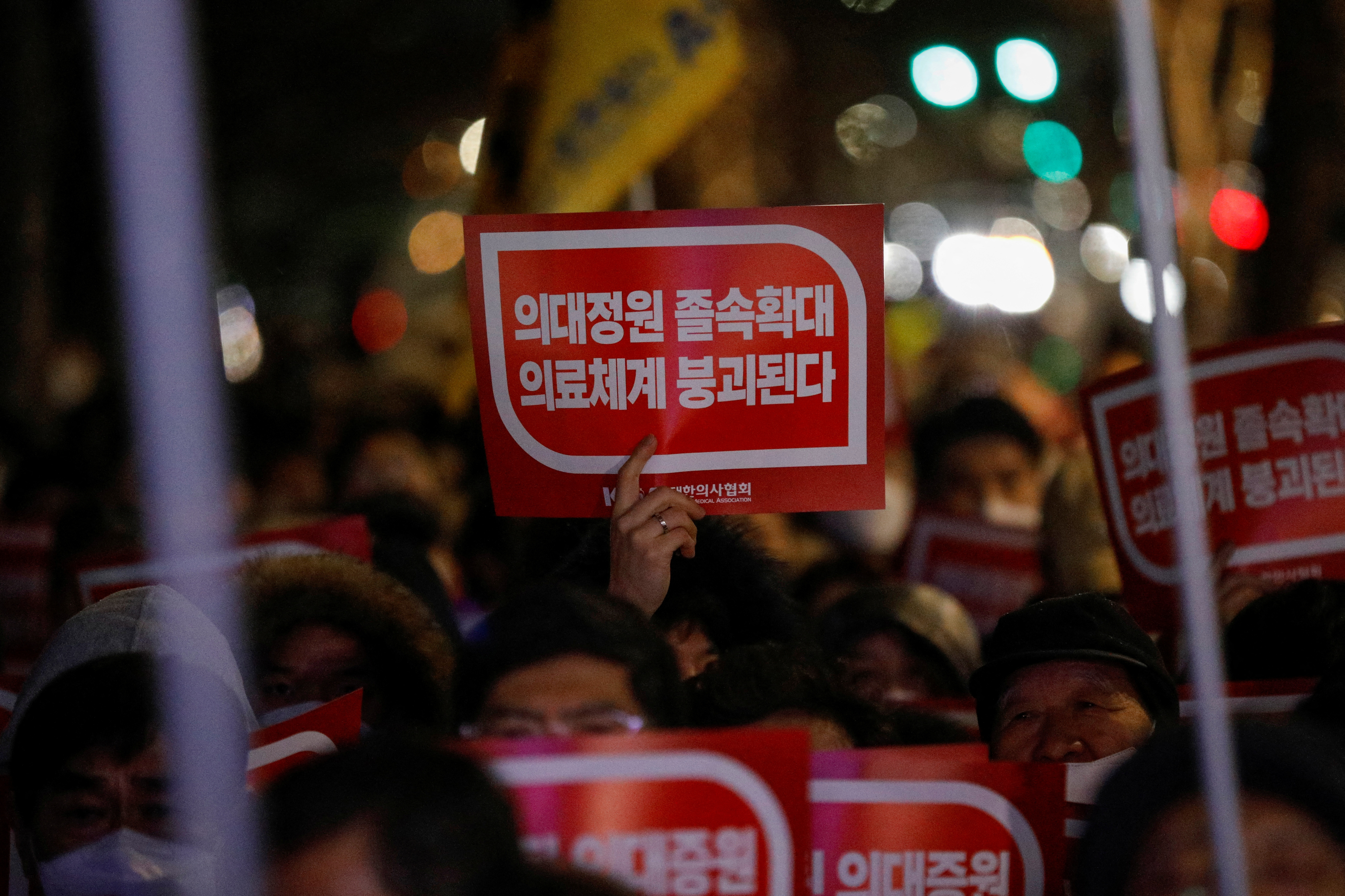 Doctors take part in a protest against a plan to admit more students to medical school, in front of the Presidential Office in Seoul