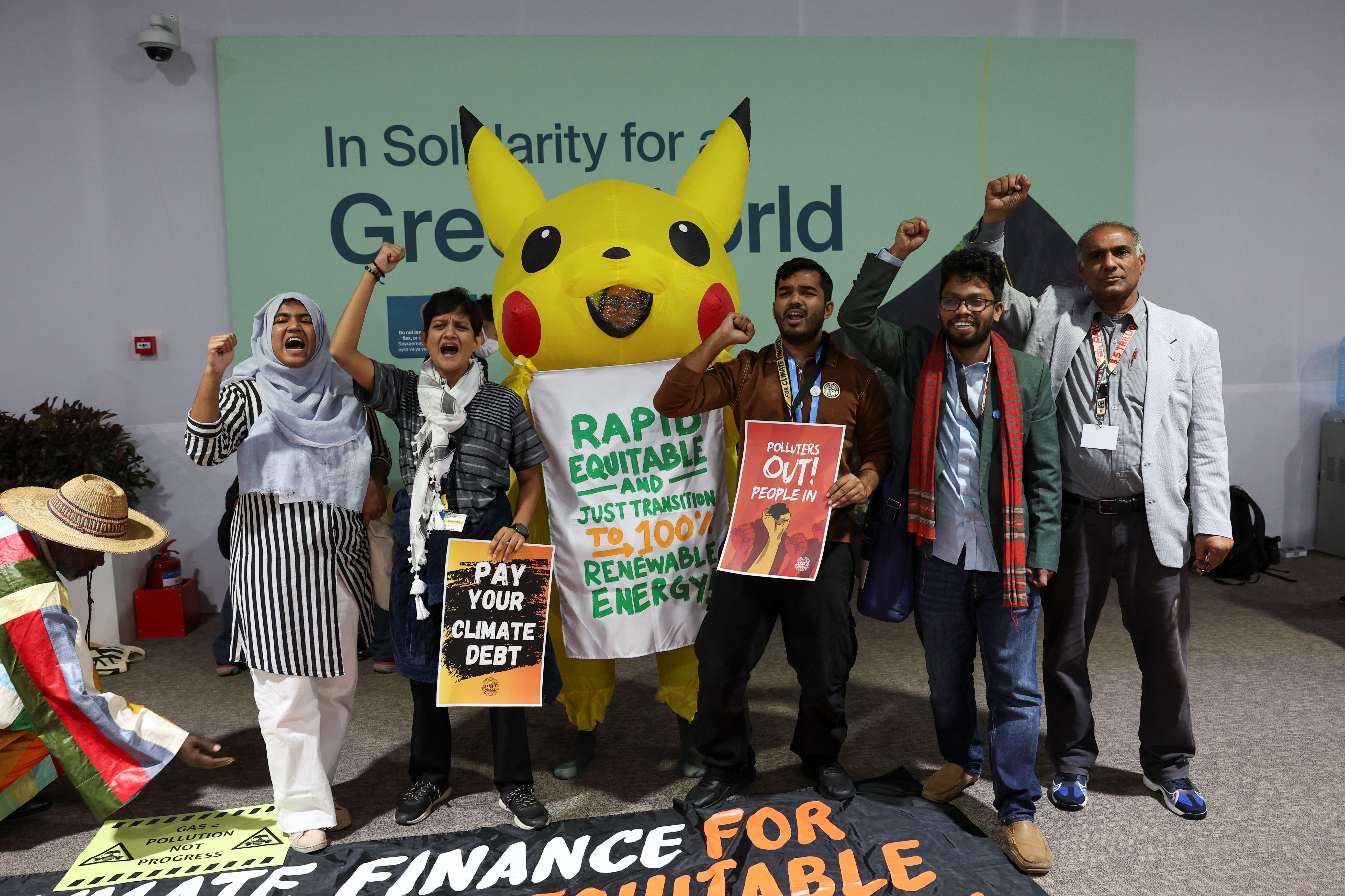 Activists protest against oil and gas lobbyists during COP29 in Baku