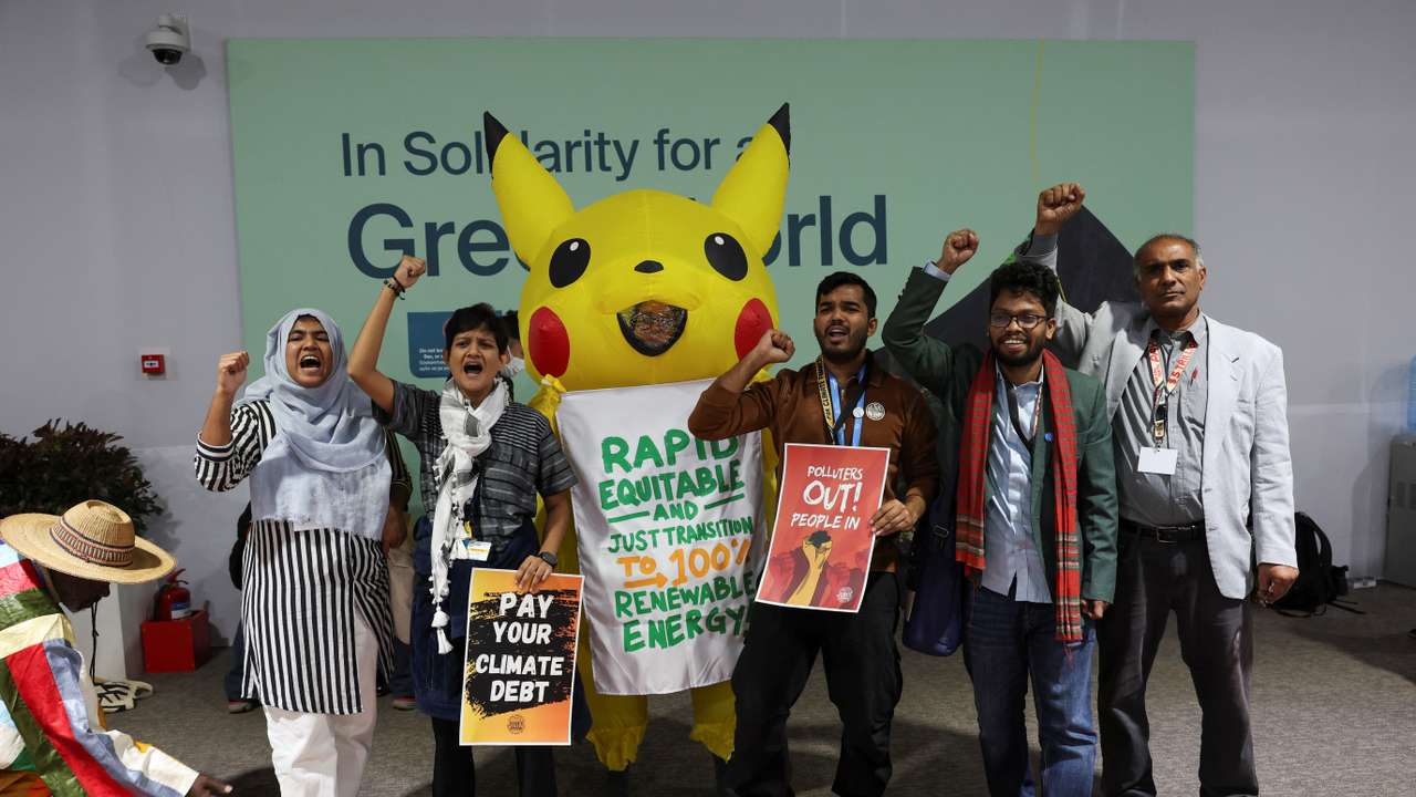 Activists protest against oil and gas lobbyists during COP29 in Baku