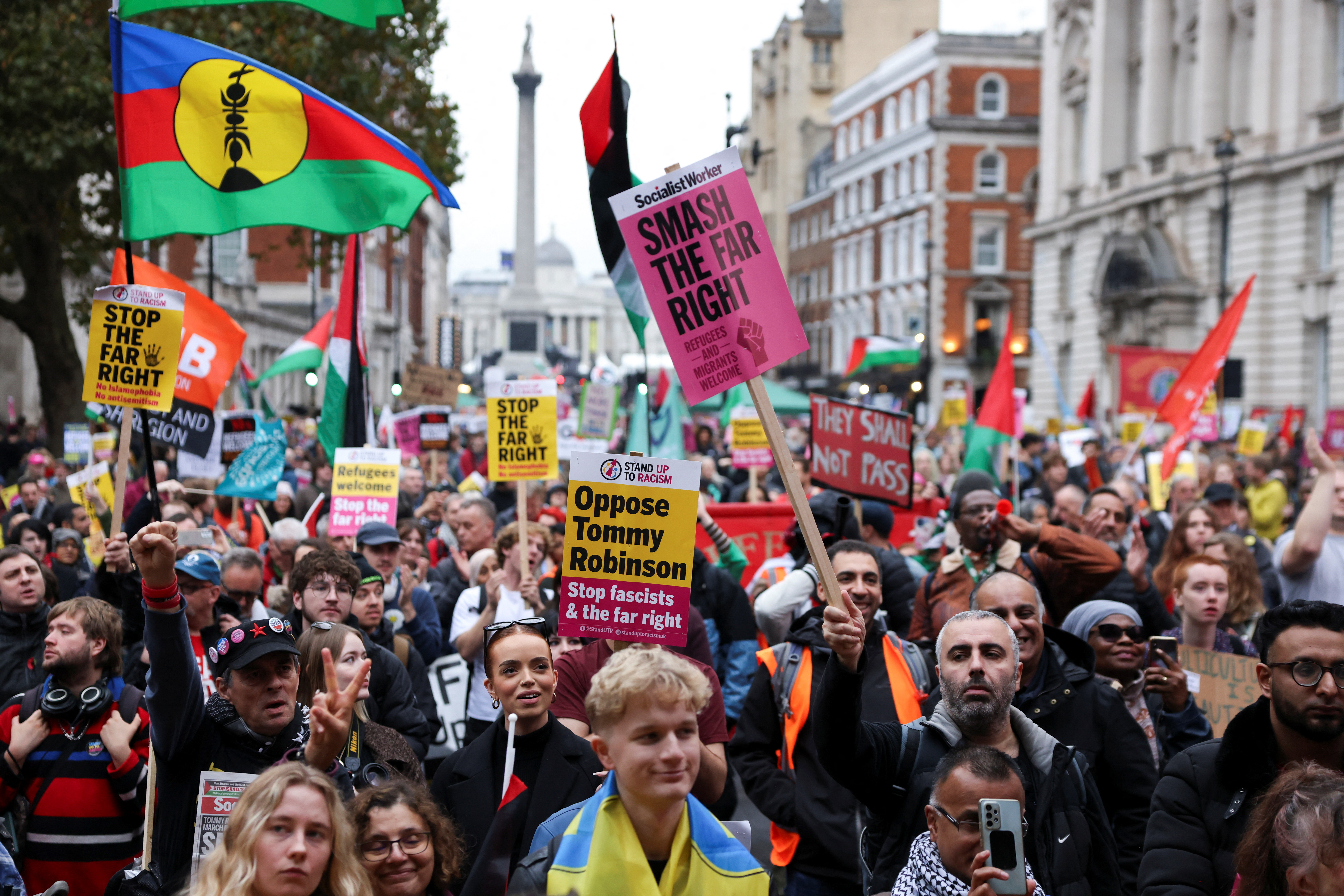 Counter-protesters take part in a demonstration against Tommy Robinson and the far-right, in London
