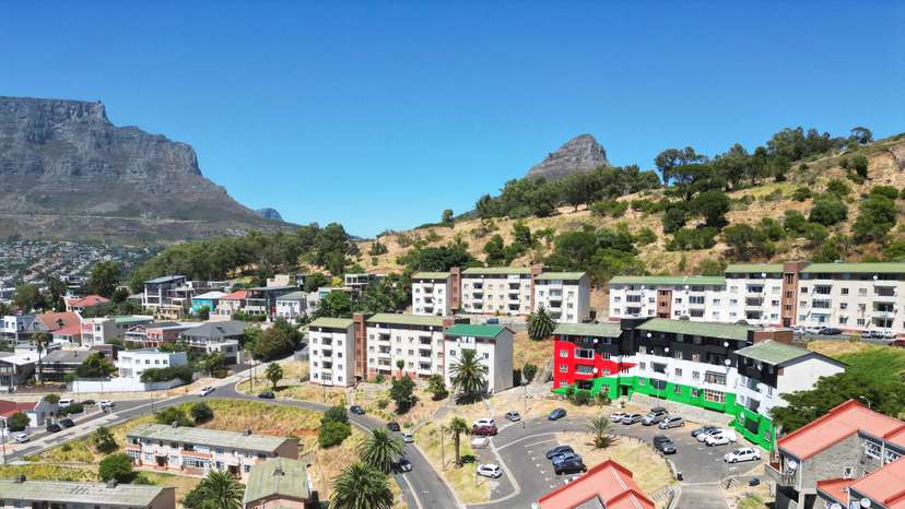 FILE PHOTO: Bo-Kaap residents and artists paint the Palestinian flag on a block of flats, in Cape Town
