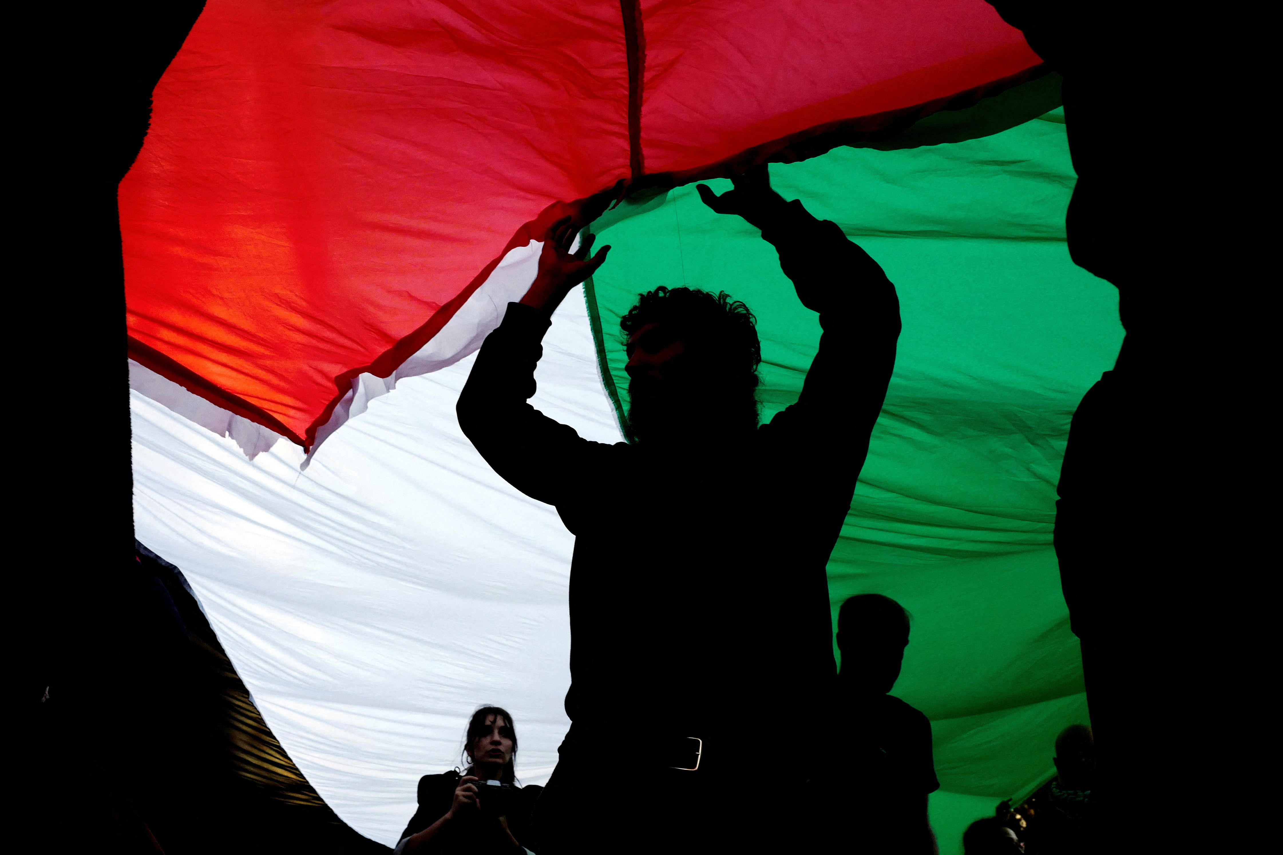 People take part in a demonstration in solidarity with Palestinians in Gaza, in Lisbon