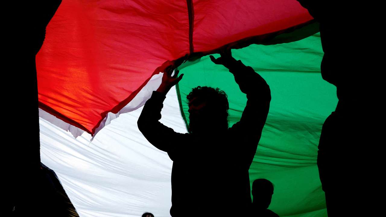 People take part in a demonstration in solidarity with Palestinians in Gaza, in Lisbon