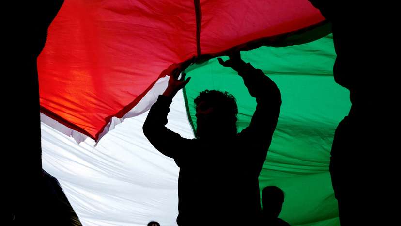 People take part in a demonstration in solidarity with Palestinians in Gaza, in Lisbon