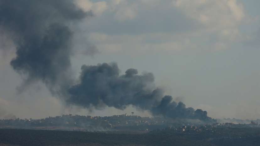 Smoke billows over southern Lebanon following Israeli strikes, as seen from Tyre, southern Lebanon