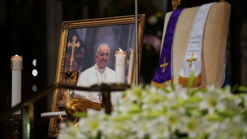 A photo of Pope Francis is kept on display as people attend morning mass after the death of Pope Francis was announced by the Vatican, at St Patrick's Cathedral in Manhattan