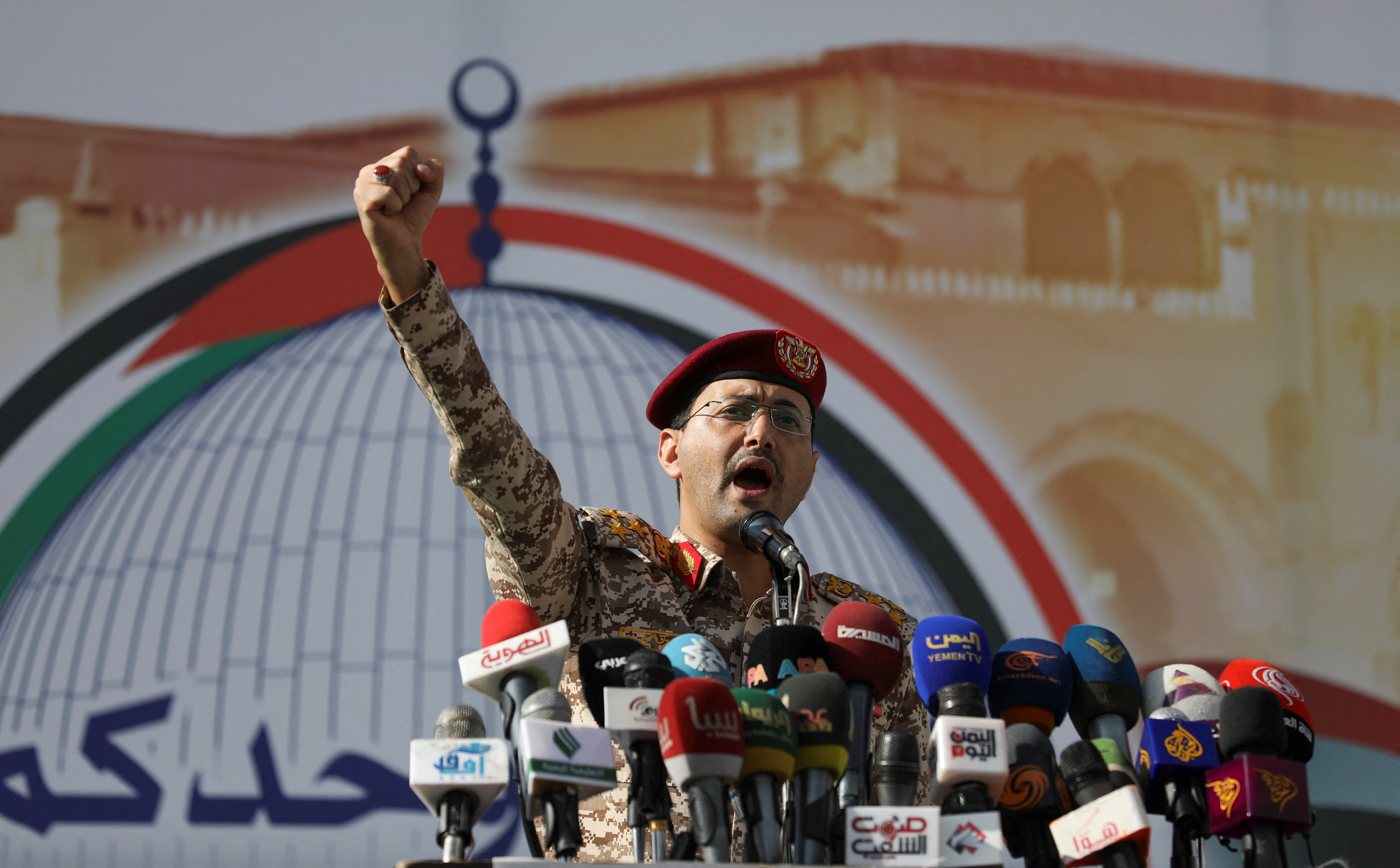 Houthi military spokesman, Yahya Sarea, chants slogans as he delivers a statement during a pro-Palestinian rally in Sanaa