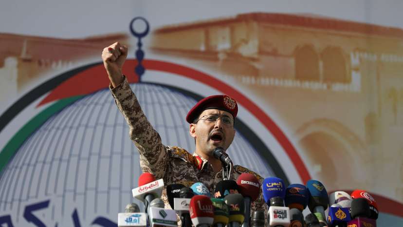 Houthi military spokesman, Yahya Sarea, chants slogans as he delivers a statement during a pro-Palestinian rally in Sanaa