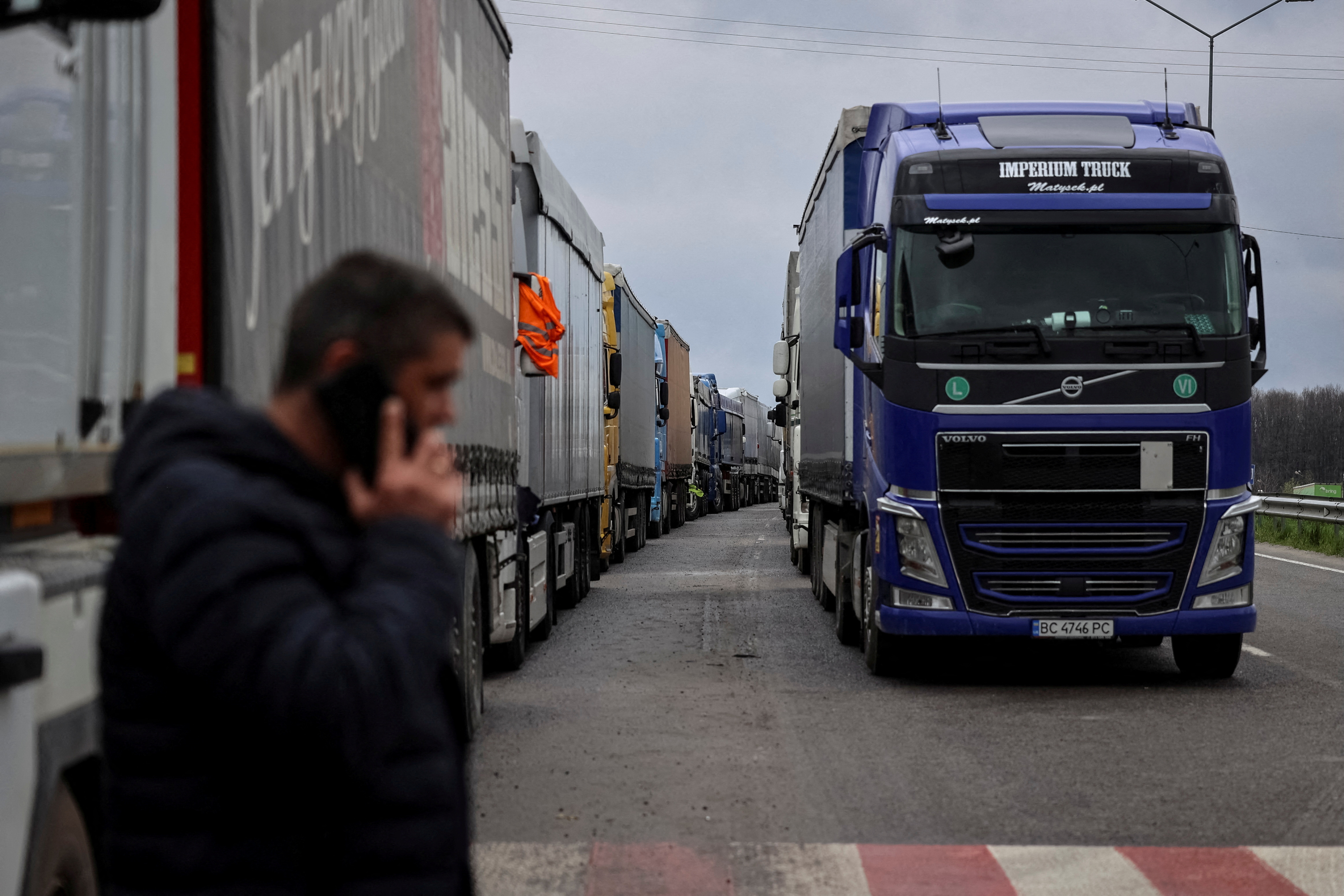 FILE PHOTO: Trucks wait for crossing the Ukraine-Poland border at the checkpoint Rava-Ruska