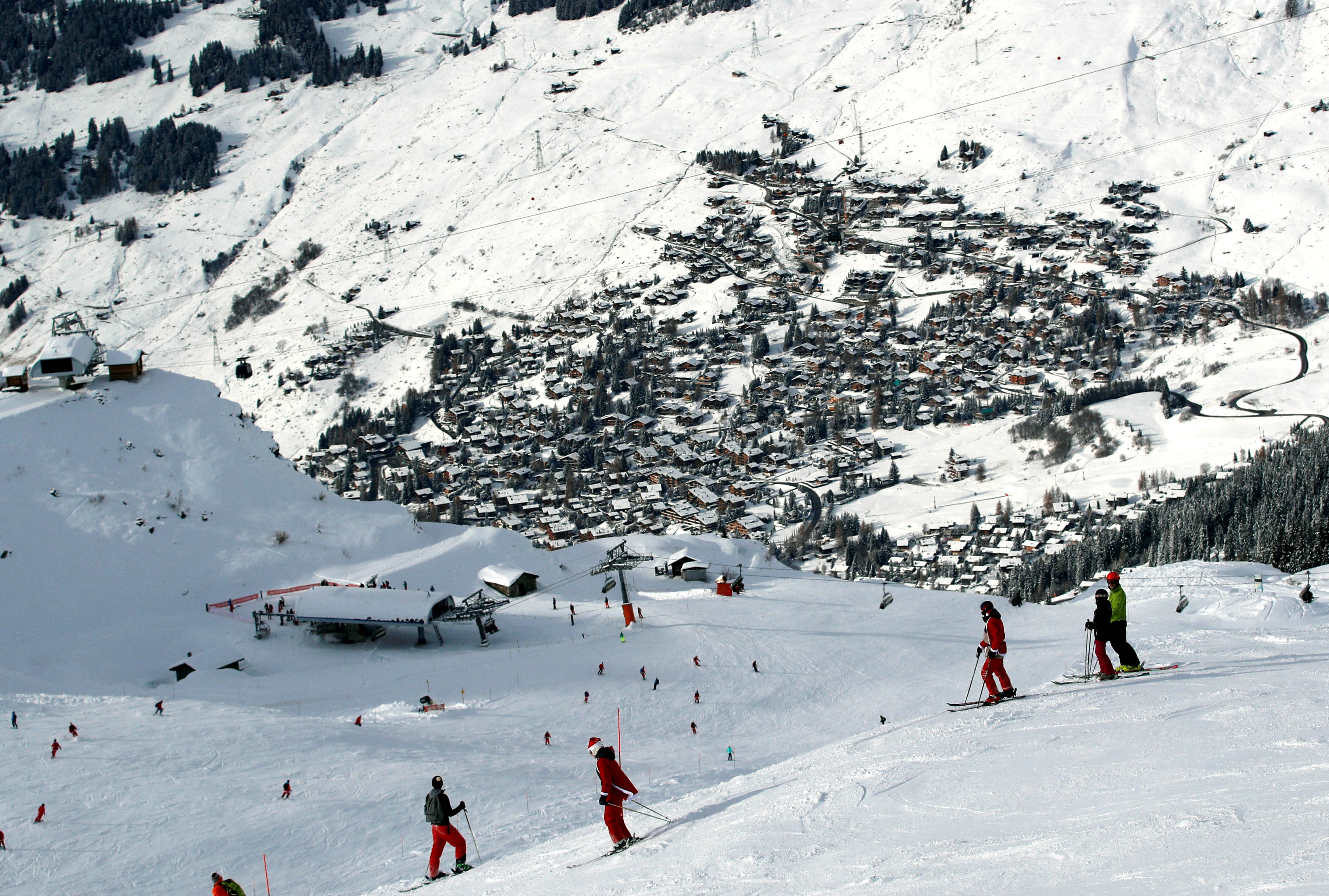 FILE PHOTO: People enjoy the snow at the season's start in the Verbier Alpine ski resort in Verbier