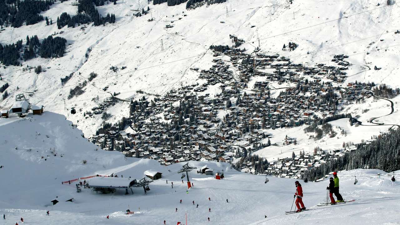 FILE PHOTO: People enjoy the snow at the season's start in the Verbier Alpine ski resort in Verbier