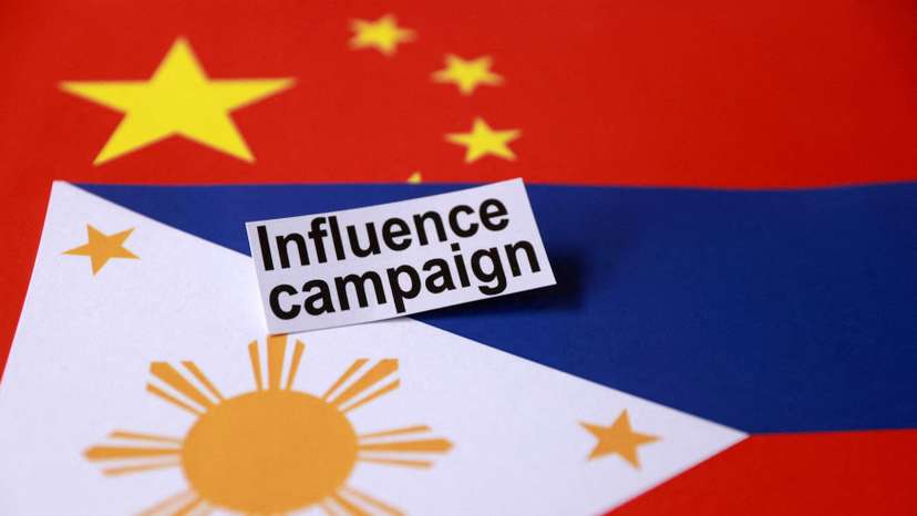 FILE PHOTO: Illustration shows a sign reading "Influence campaign" and Chinese and Philippines flags