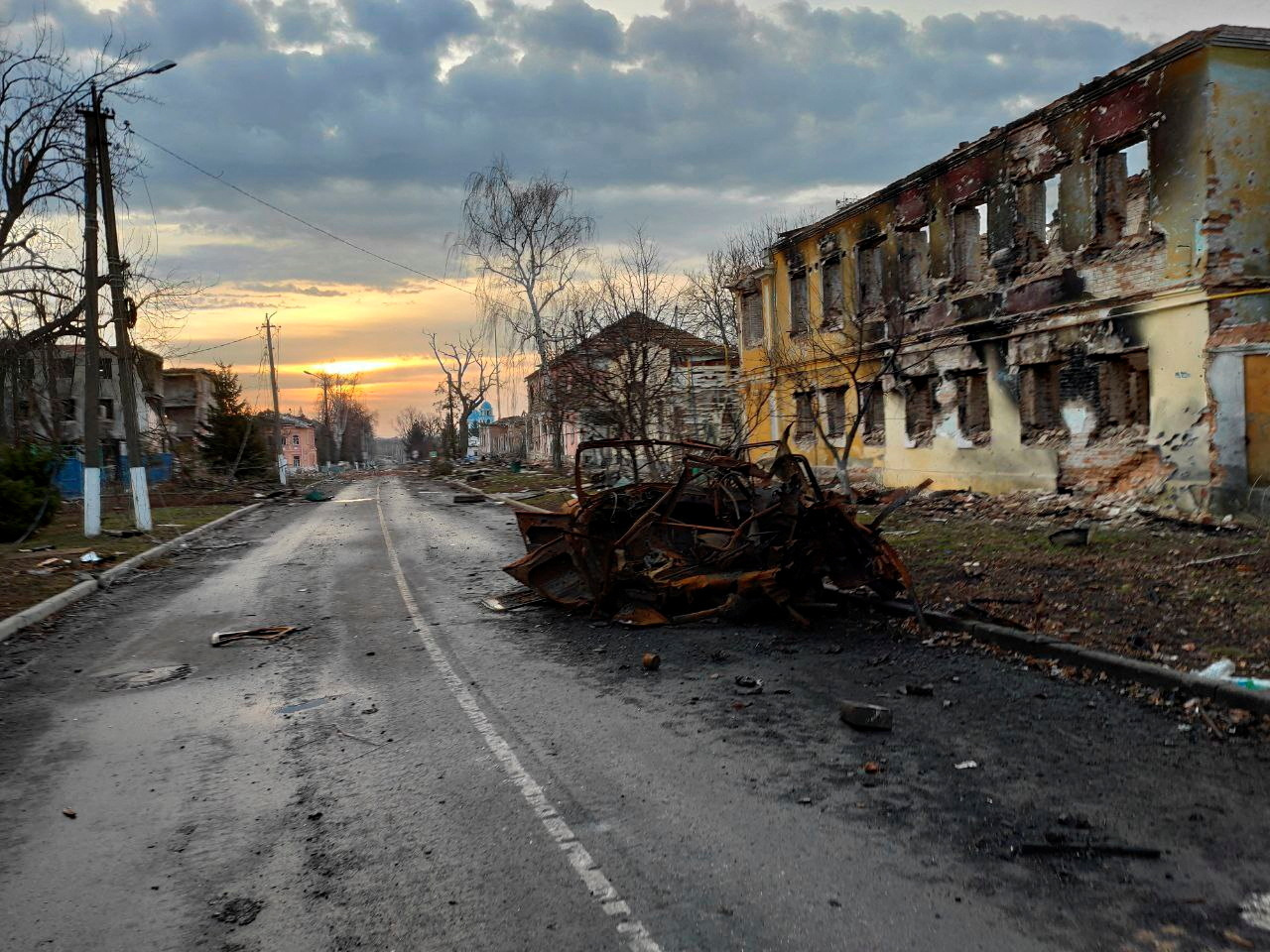 A view shows a destroyed vehicle on a street in Sudzha