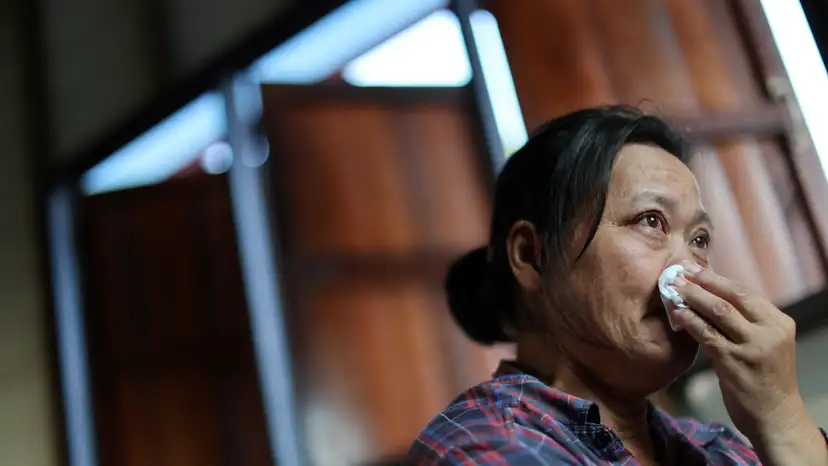 Wiwwaro Sriaoun, mother of a remaining Thai hostage captured by Hamas, Watchara Sriaoun, reacts during an interview with Reuters