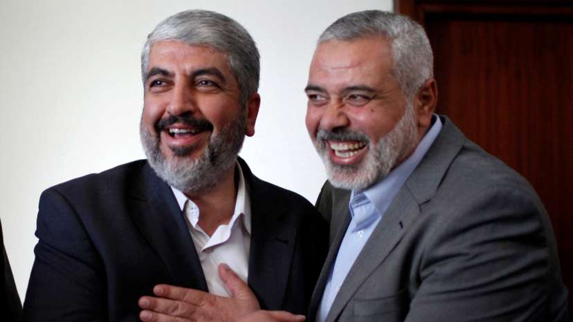 FILE PHOTO: Hamas chief Khaled Meshaal hugs senior Hamas leader Ismail Haniyeh before leaving Gaza Strip