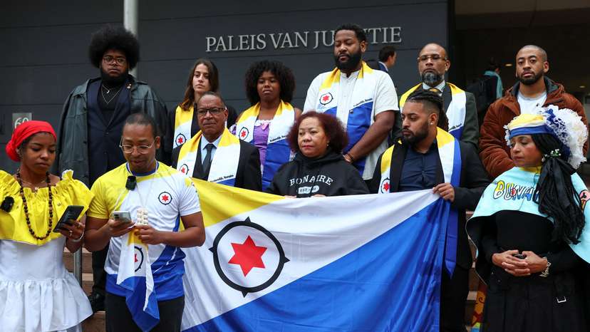 People protest in front of district court that hears case regarding Bonaire, in The Hague