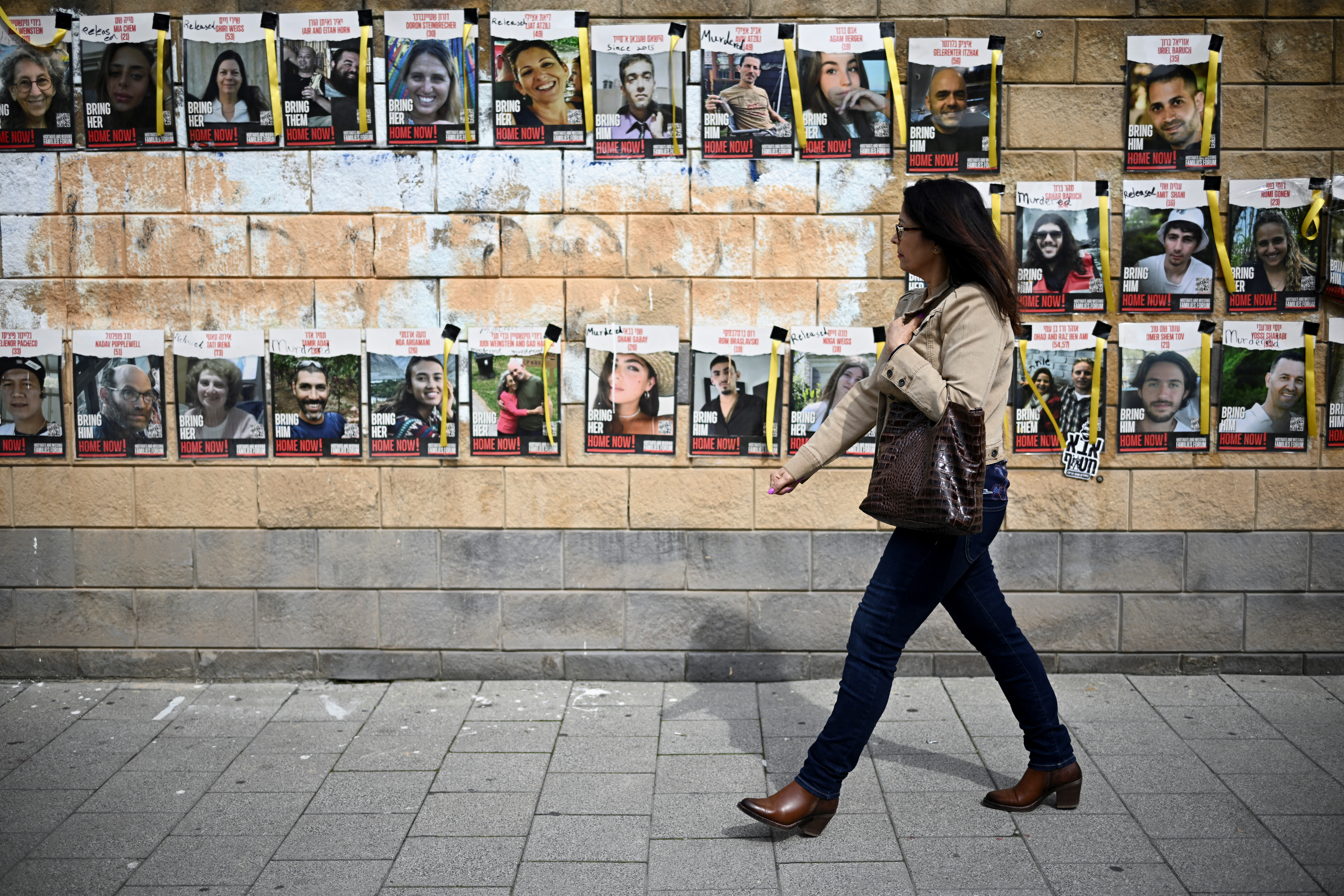 Banners display photos of hostages kidnapped on the deadly October 7 attack, in Tel Aviv