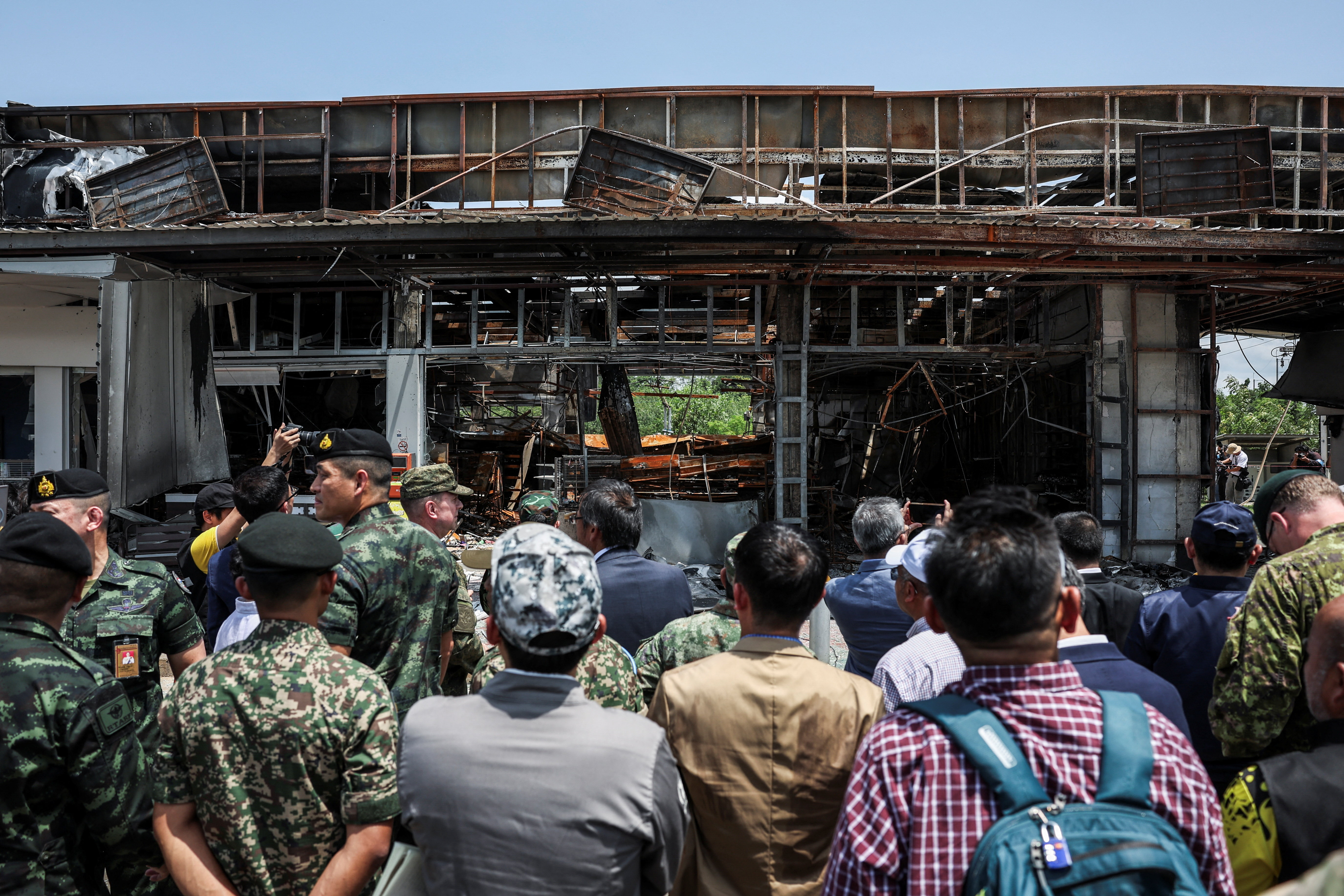 Foreign military attaches from major powers and ASEAN member countries inspect at Thai-Cambodia border, following a ceasefire between Cambodia and Thailand, in Sisaket province