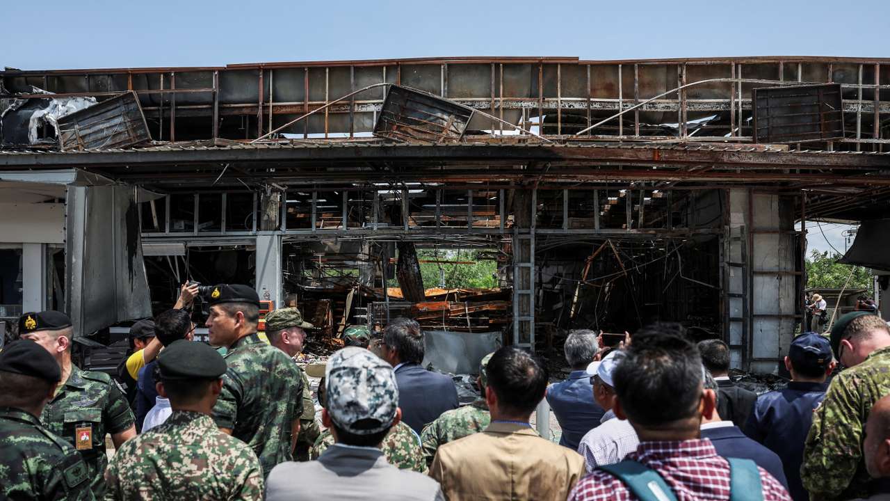 Foreign military attaches from major powers and ASEAN member countries inspect at Thai-Cambodia border, following a ceasefire between Cambodia and Thailand, in Sisaket province