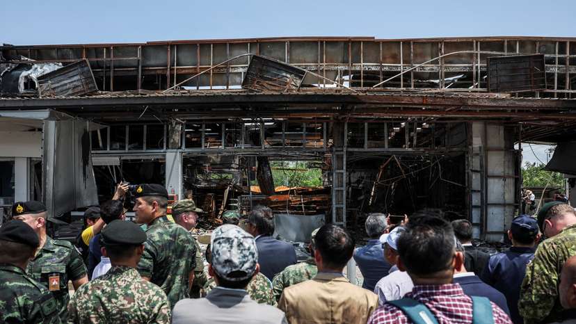 Foreign military attaches from major powers and ASEAN member countries inspect at Thai-Cambodia border, following a ceasefire between Cambodia and Thailand, in Sisaket province