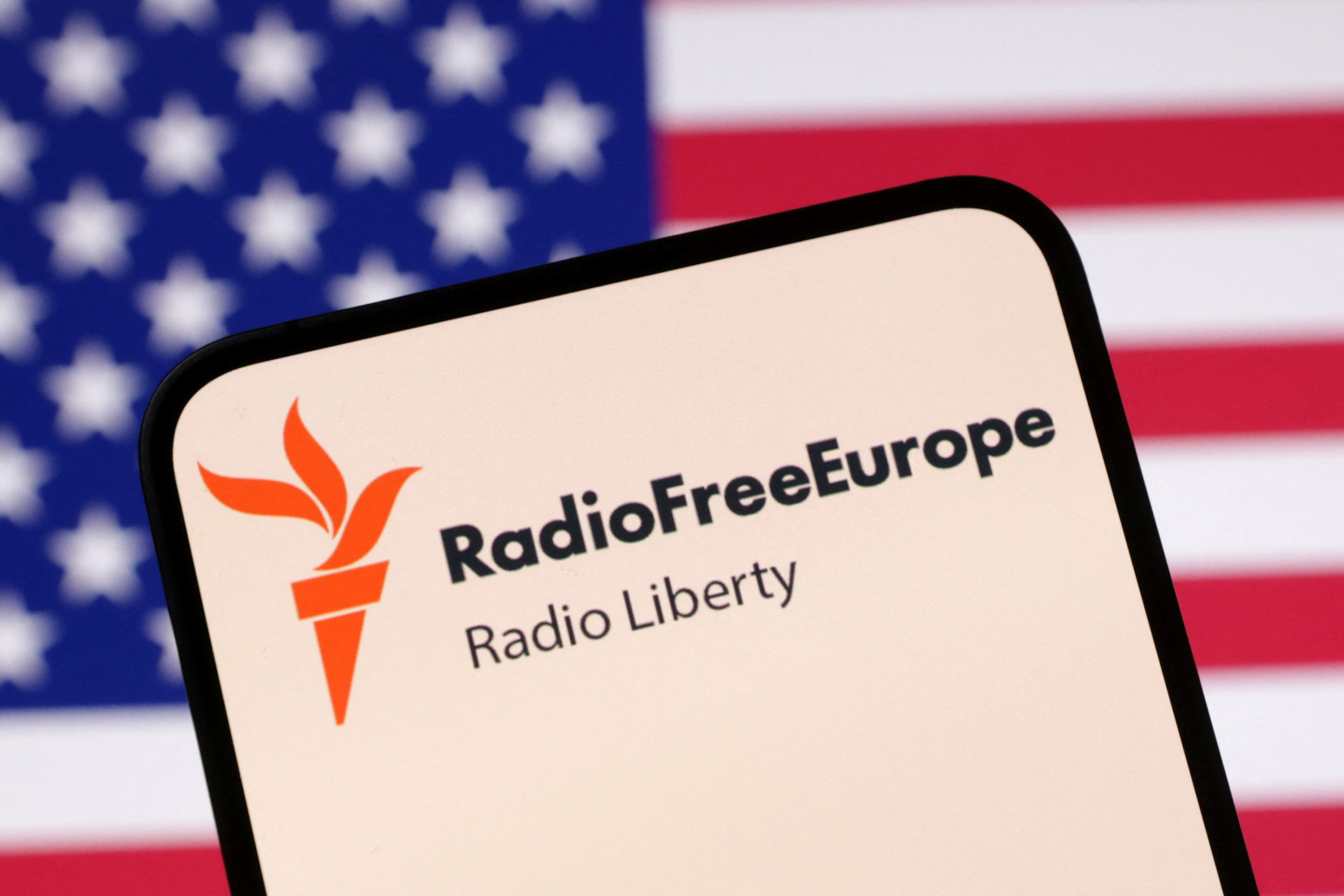 Illustration shows Radio Free Europe logo and U.S. flag