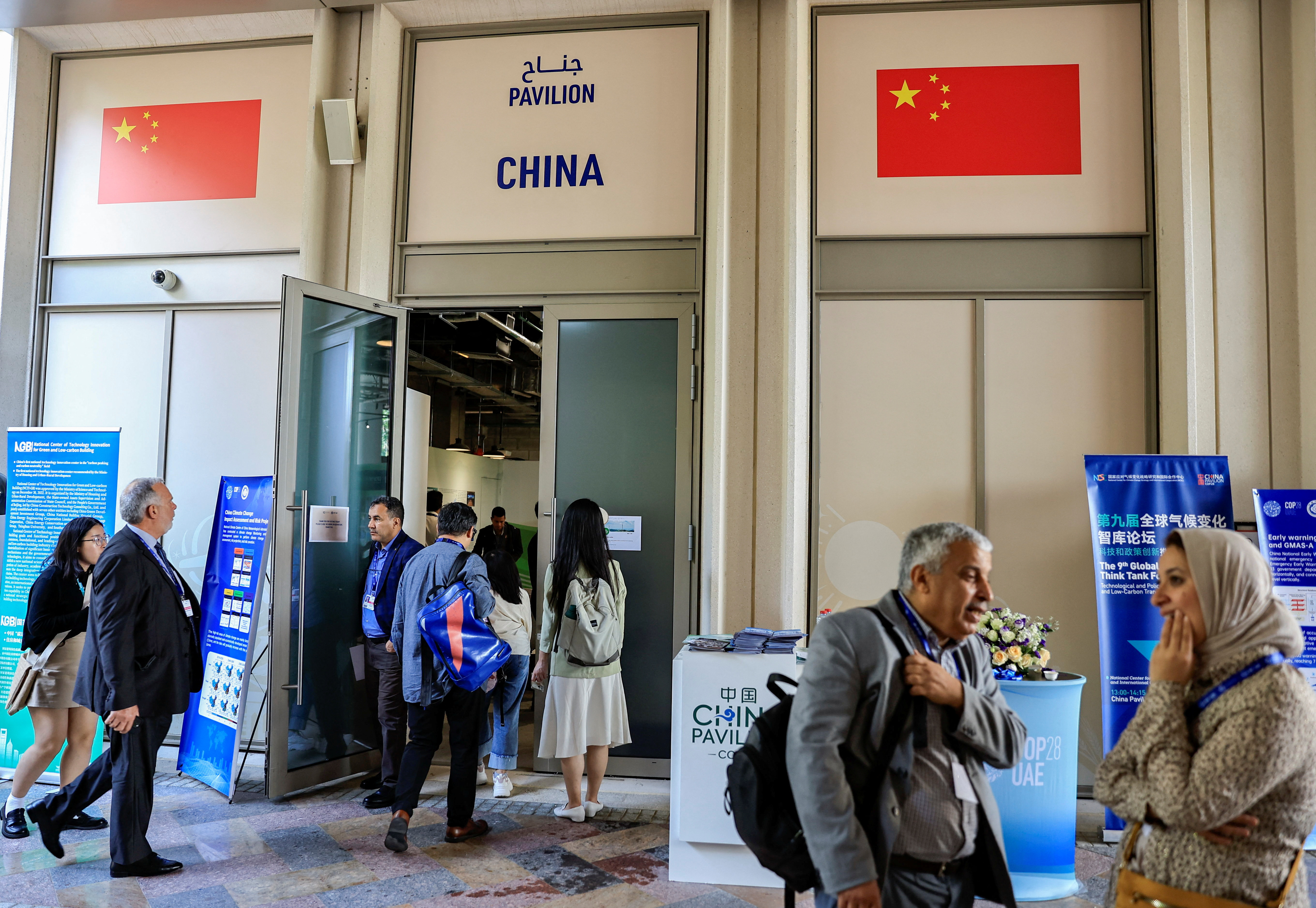 People stand outside the China Pavilion at the United Nations Climate Change Conference COP28 in Dubai