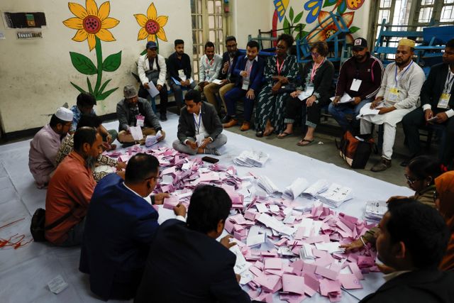 Officials sort the ballots before counting the votes, during the 13th general election in Dhaka, Bangladesh, February 12, 2026. REUTERS/Mohammad Ponir Hossain
