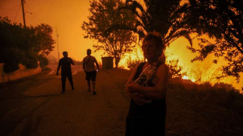 Wildifre burns in the village of Latas in southern Greece