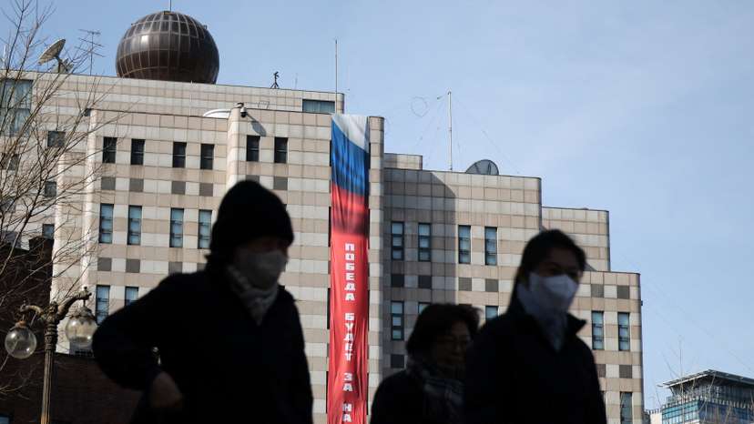 A banner that reads "Victory will be ours" hangs on the exterior of the Russian Embassy in Seoul