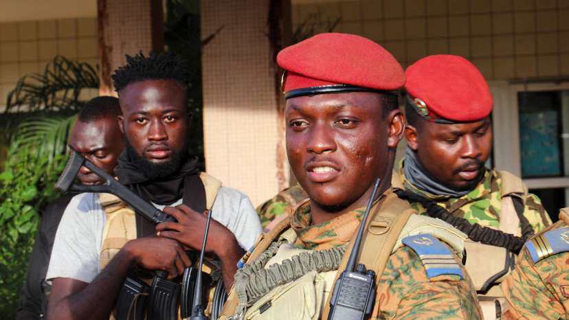 FILE PHOTO: Burkina Faso's new military leader Ibrahim Traore is escorted by soldiers in Ouagadougou
